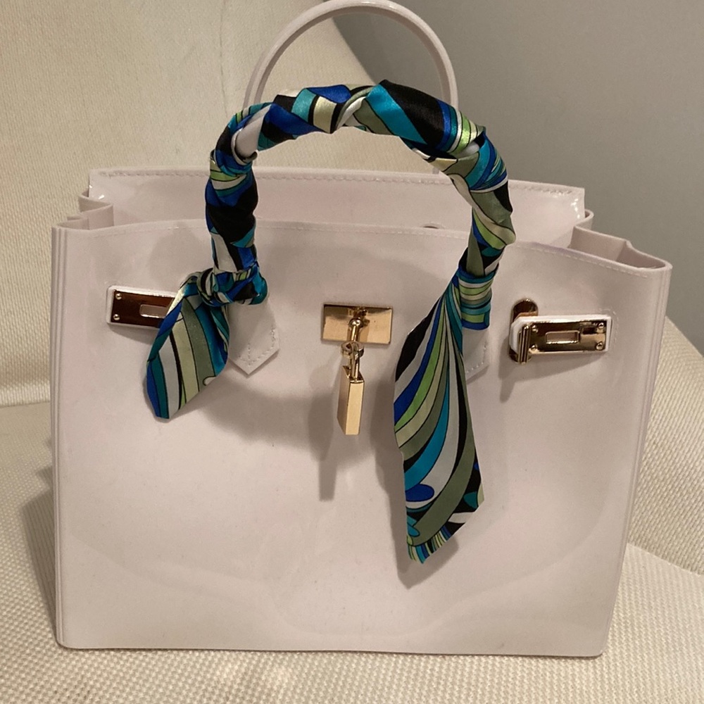 Birkin style Bag.  White heavy plastic bag with Silk Twilly scarf on the handle.